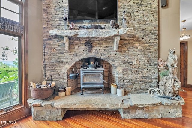 18549 Landridge Way, Abingdon, VA 24211 - detailed view of wood finished floors, a wood stove, and baseboards