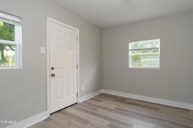 1605 E Fairview Ave, Johnson City, TN 37601 - spare room with healthy amount of natural light, wood finished floors, and baseboards