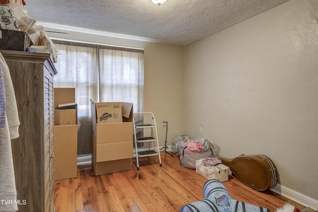 1321 Pineola Ave, Kingsport, TN 37664 - misc room featuring a textured ceiling, wood-type flooring, a textured wall, and baseboards