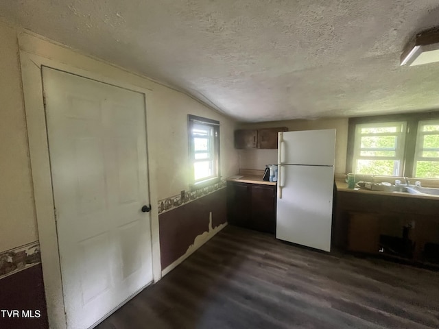 11352 Frederick Rd, Coeburn, VA 24230 - kitchen featuring freestanding refrigerator, a textured ceiling, dark wood-style floors, a sink, and light countertops