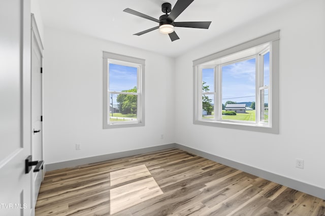 280 Mitchell Rd, Chuckey, TN 37641 - unfurnished room featuring healthy amount of natural light, wood finished floors, and a ceiling fan