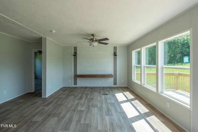 385 Piney Grove Rd, Greeneville, TN 37743 - spare room featuring ceiling fan, wood finished floors, a textured ceiling, baseboards, and crown molding