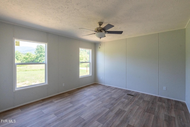 385 Piney Grove Rd, Greeneville, TN 37743 - unfurnished room featuring wood finished floors, a textured ceiling, ceiling fan, and baseboards
