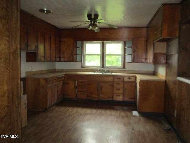 19374 Benhams Rd, Bristol, VA 24202 - kitchen with ceiling fan, a sink, light wood-style flooring, and brown cabinets