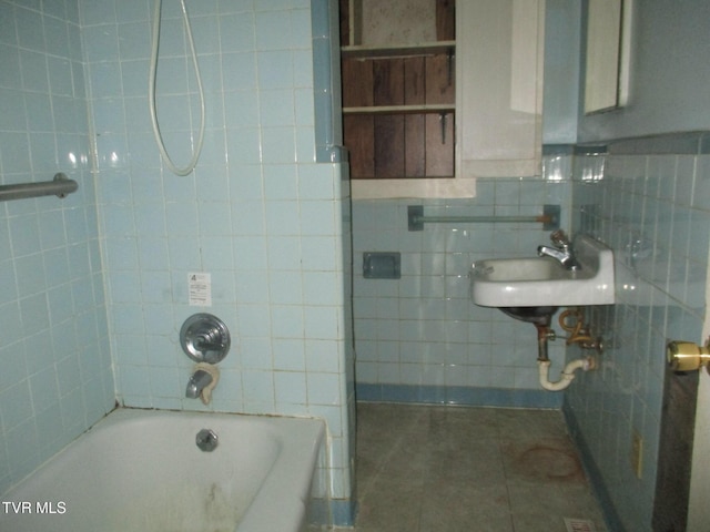 19374 Benhams Rd, Bristol, VA 24202 - full bath featuring tile walls, tile patterned floors, a sink, and  shower combination