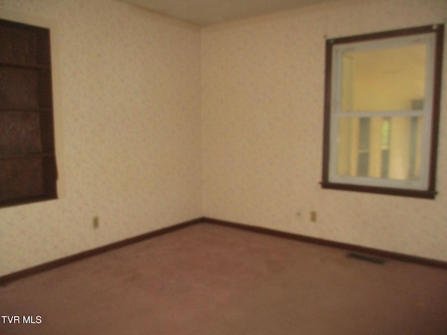 19374 Benhams Rd, Bristol, VA 24202 - unfurnished room with wallpapered walls, carpet floors, and baseboards