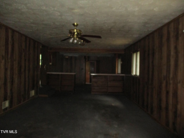 19374 Benhams Rd, Bristol, VA 24202 - finished below grade area with a ceiling fan and wood walls