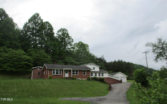 19374 Benhams Rd, Bristol, VA 24202 - view of front of house with an outbuilding, a front lawn, and a detached garage