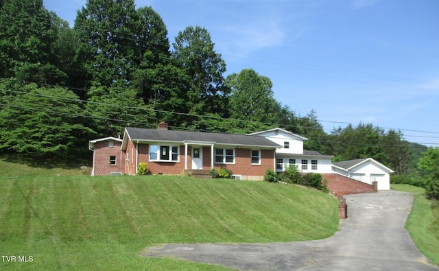 19374 Benhams Rd, Bristol, VA 24202 - view of front of house featuring an outdoor structure, brick siding, a front yard, and a detached garage