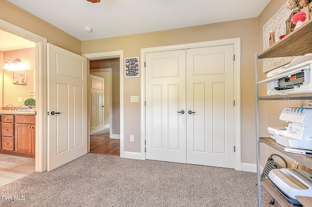 133 Christopher Way, Blountville, TN 37617 - bedroom featuring light colored carpet, a closet, baseboards, and ensuite bath
