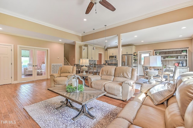 133 Christopher Way, Blountville, TN 37617 - living area featuring french doors, light wood-style floors, ceiling fan, stairway, and ornamental molding