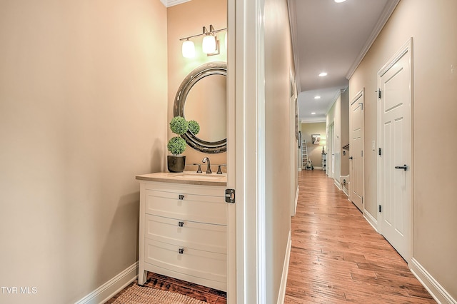133 Christopher Way, Blountville, TN 37617 - corridor featuring ornamental molding, a sink, baseboards, light wood finished floors, and recessed lighting