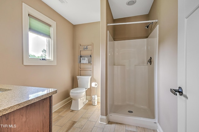 133 Christopher Way, Blountville, TN 37617 - bathroom featuring baseboards, toilet, a shower stall, and wood finish floors
