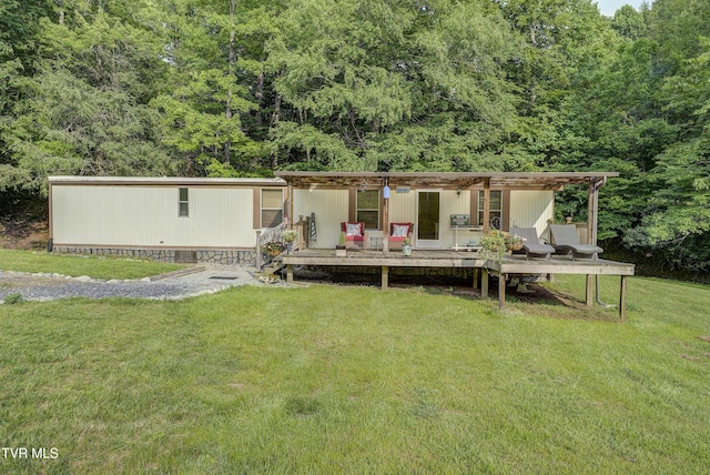 111 Jd Whitehead Rd, Roan Mountain, TN 37687 - view of front of home featuring a front yard, a view of trees, and a deck