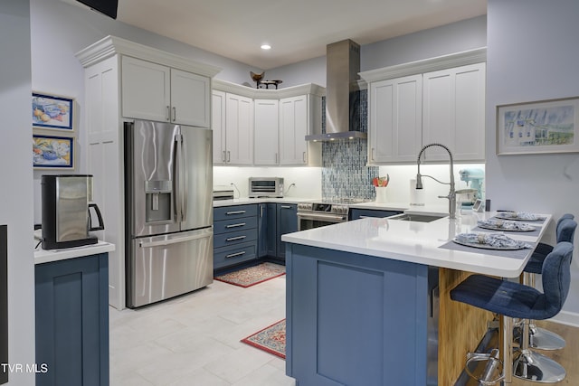 111 Jd Whitehead Rd, Roan Mountain, TN 37687 - kitchen with appliances with stainless steel finishes, wall chimney range hood, a peninsula, a kitchen breakfast bar, and light countertops
