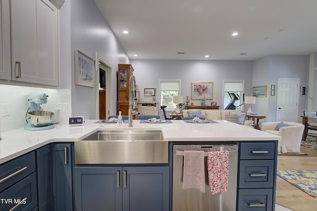 111 Jd Whitehead Rd, Roan Mountain, TN 37687 - kitchen featuring dishwasher, open floor plan, a peninsula, light wood-type flooring, and light countertops