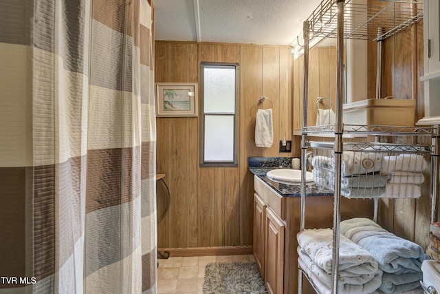 111 Jd Whitehead Rd, Roan Mountain, TN 37687 - full bath featuring wooden walls, vanity, healthy amount of natural light, curtained shower, and a textured ceiling