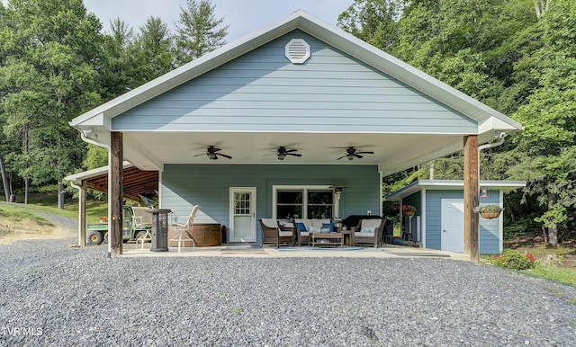 111 Jd Whitehead Rd, Roan Mountain, TN 37687 - view of front of property featuring outdoor lounge area, ceiling fan, a storage unit, and a patio area