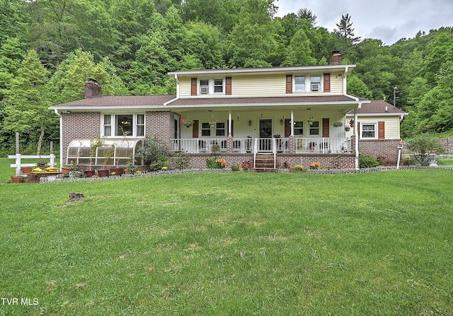 24483 Cave Creek Rd, Abingdon, VA 24211 - view of front facade with a chimney, a forest view, covered porch, and brick siding
