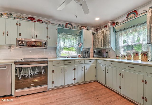 24483 Cave Creek Rd, Abingdon, VA 24211 - kitchen featuring appliances with stainless steel finishes, backsplash, light countertops, a ceiling fan, and recessed lighting