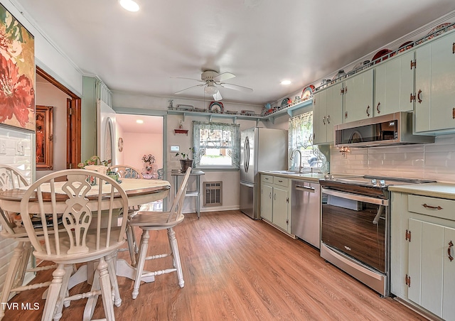 24483 Cave Creek Rd, Abingdon, VA 24211 - kitchen featuring appliances with stainless steel finishes, ceiling fan, backsplash, light countertops, and recessed lighting