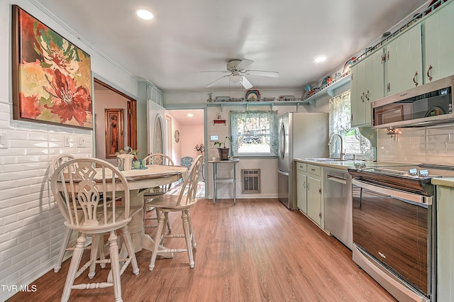 24483 Cave Creek Rd, Abingdon, VA 24211 - kitchen with appliances with stainless steel finishes, green cabinets, ceiling fan, light wood finished floors, and recessed lighting