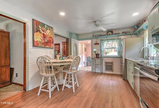 24483 Cave Creek Rd, Abingdon, VA 24211 - kitchen featuring a ceiling fan, light wood-style flooring, stainless steel appliances, baseboards, and a sink