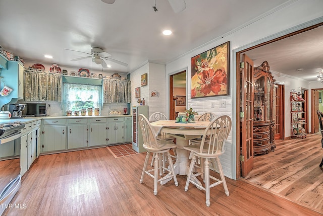 24483 Cave Creek Rd, Abingdon, VA 24211 - kitchen featuring ceiling fan, ornamental molding, light wood-style floors, light countertops, and stainless steel range