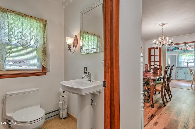 24483 Cave Creek Rd, Abingdon, VA 24211 - bathroom with baseboard heating, crown molding, a chandelier, toilet, and baseboards