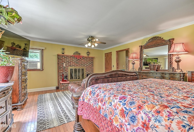 24483 Cave Creek Rd, Abingdon, VA 24211 - bedroom featuring a fireplace, hardwood / wood-style floors, crown molding, cooling unit, and baseboards