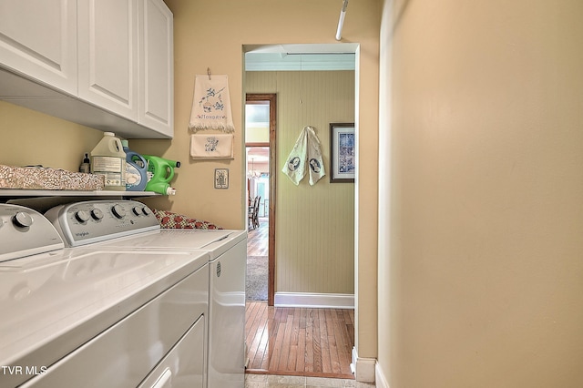 24483 Cave Creek Rd, Abingdon, VA 24211 - laundry room with washer and dryer, cabinet space, attic access, baseboards, and light wood-style flooring