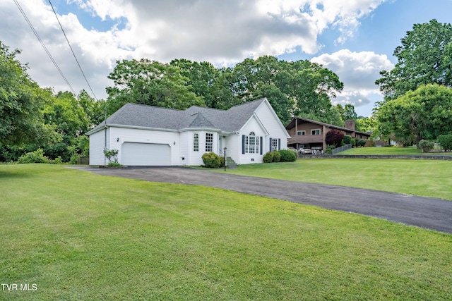 4006 Navaho Dr, Johnson City, TN 37604 - view of front of home featuring an attached garage, asphalt driveway, and a front lawn