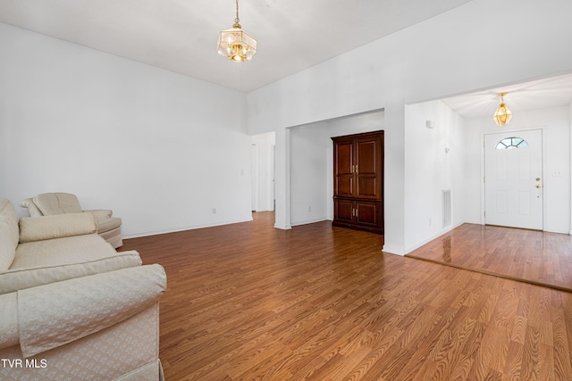 4006 Navaho Dr, Johnson City, TN 37604 - living area with wood finished floors, a chandelier, and baseboards