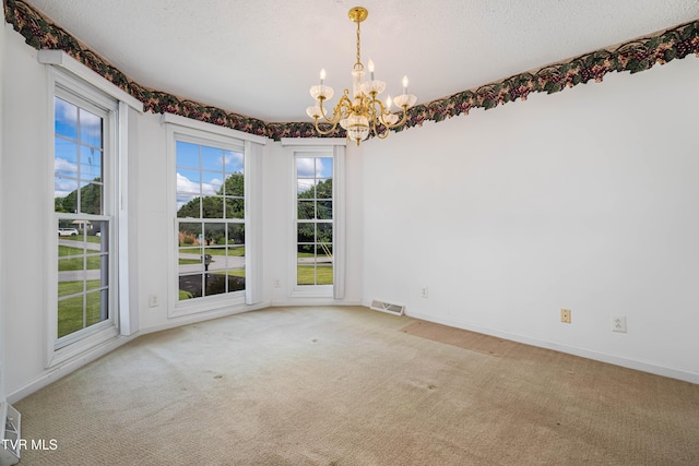 4006 Navaho Dr, Johnson City, TN 37604 - spare room featuring a chandelier, carpet flooring, baseboards, and a textured ceiling