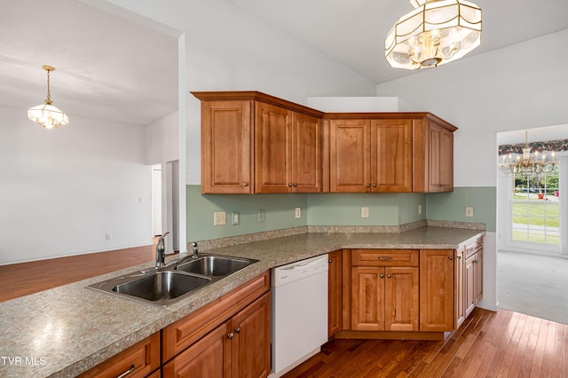 4006 Navaho Dr, Johnson City, TN 37604 - kitchen featuring white dishwasher, a chandelier, a sink, dark wood finished floors, and high vaulted ceiling