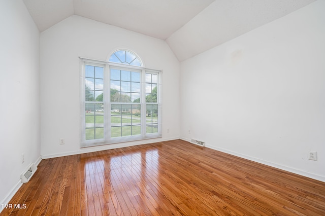 4006 Navaho Dr, Johnson City, TN 37604 - spare room featuring hardwood / wood-style flooring, vaulted ceiling, and baseboards