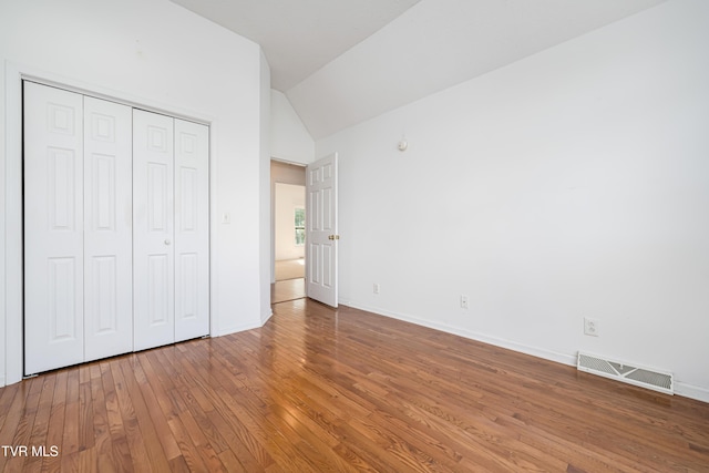 4006 Navaho Dr, Johnson City, TN 37604 - unfurnished bedroom featuring lofted ceiling, wood-type flooring, a closet, and baseboards
