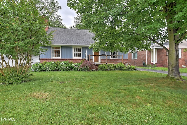 1449 Warpath Dr, Kingsport, TN 37664 - view of front of property featuring brick siding, a front lawn, and a shingled roof