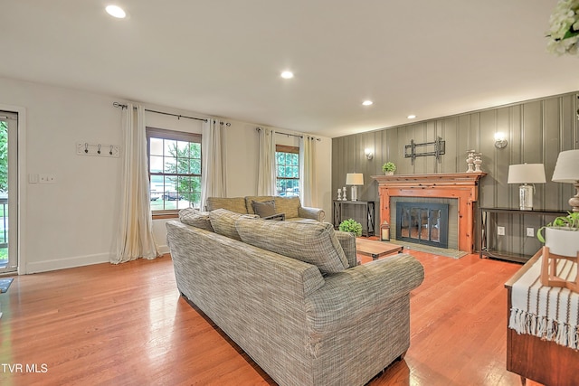 1449 Warpath Dr, Kingsport, TN 37664 - living room with light wood finished floors, a glass covered fireplace, recessed lighting, and baseboards
