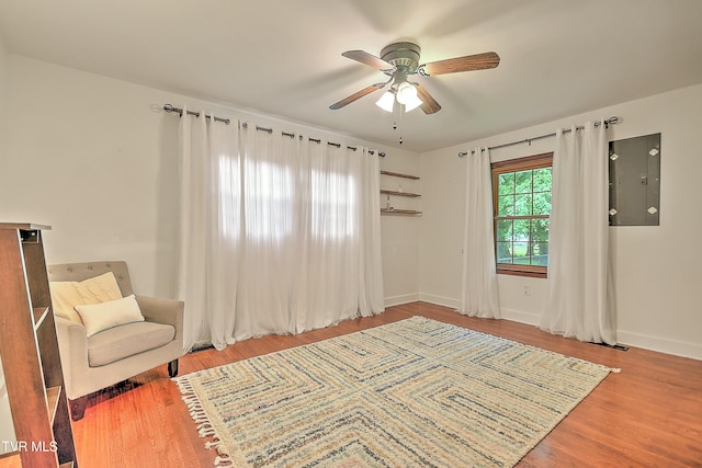 1449 Warpath Dr, Kingsport, TN 37664 - living area featuring ceiling fan, wood finished floors, electric panel, and baseboards