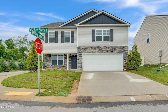 1104 Tay Sta, Kingsport, TN 37660 - view of front of property with stone siding, board and batten siding, an attached garage, and a front yard
