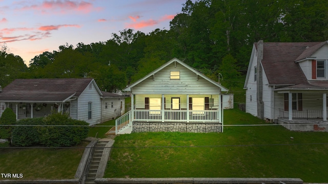 631 NE Meadow St, Coeburn, VA 24230 - view of front of home featuring covered porch and a front lawn
