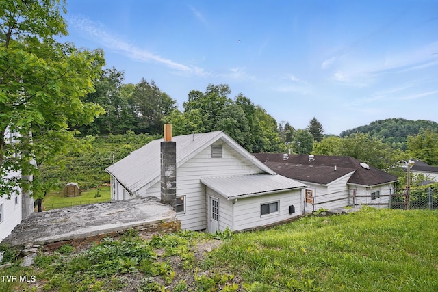 631 NE Meadow St, Coeburn, VA 24230 - rear view of house with a chimney