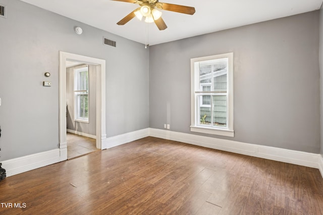 115 W Poplar St, Johnson City, TN 37604 - unfurnished room featuring a ceiling fan, wood finished floors, baseboards, and a smoke detector