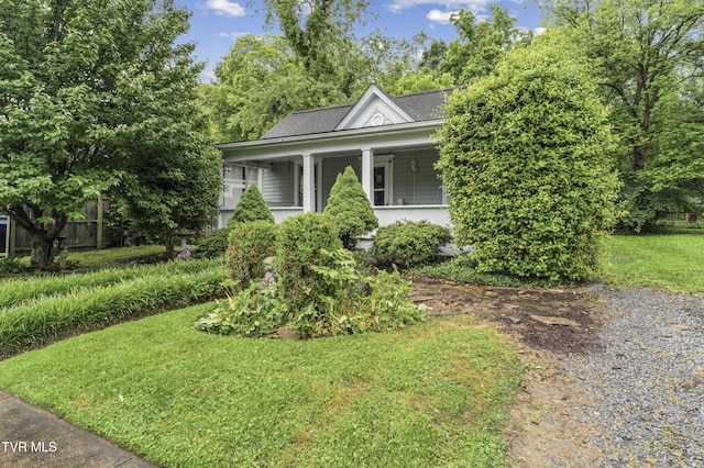115 W Poplar St, Johnson City, TN 37604 - view of front facade featuring a front yard, a shingled roof, and covered porch