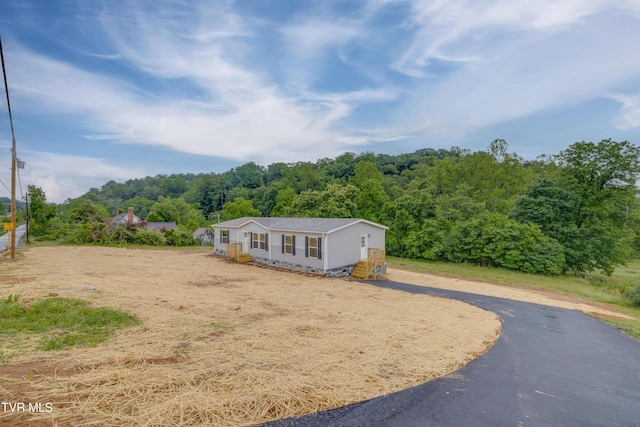 913 Henry Harr Rd, Blountville, TN 37617 - manufactured / mobile home with a forest view and asphalt driveway