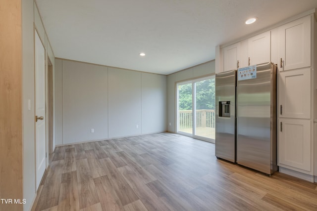 913 Henry Harr Rd, Blountville, TN 37617 - kitchen featuring stainless steel fridge, light wood-type flooring, white cabinetry, recessed lighting, and baseboards