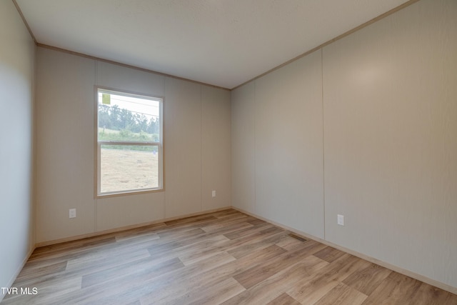 913 Henry Harr Rd, Blountville, TN 37617 - unfurnished room with light wood-style flooring, crown molding, and baseboards