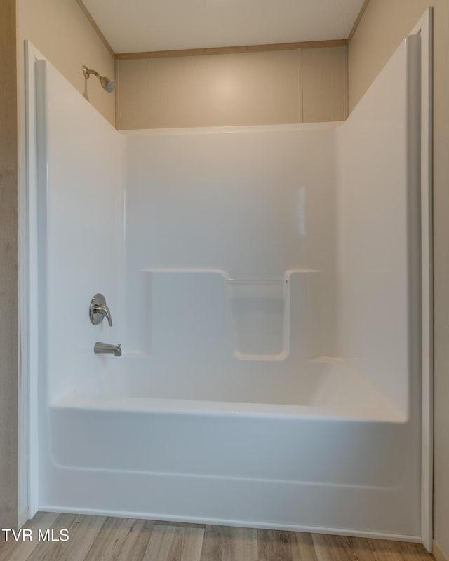 913 Henry Harr Rd, Blountville, TN 37617 - bathroom featuring bathing tub / shower combination and wood finished floors