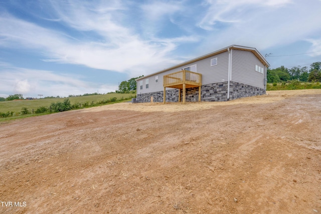 913 Henry Harr Rd, Blountville, TN 37617 - rear view of house with a deck and stone siding